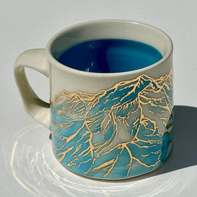 Astrid Kruse 12oz Light Blue Golden Mountain Mug #N1946