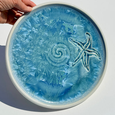 Dinner plate with starfish and swirl